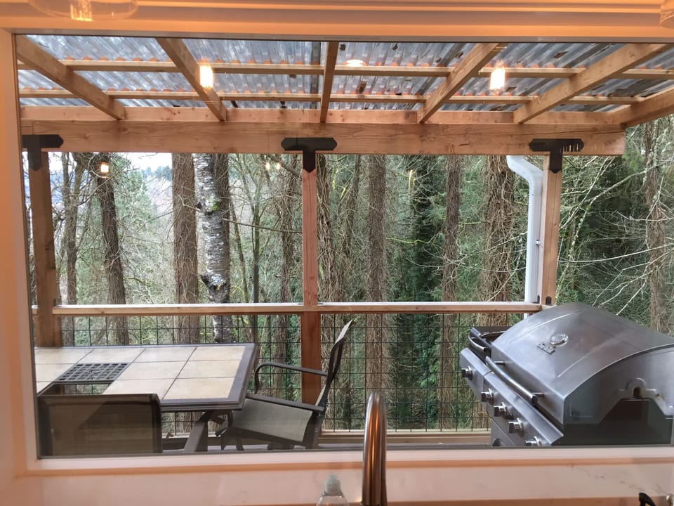 Even the kitchen sink has a view. We provide outdoor natural gas barbeque