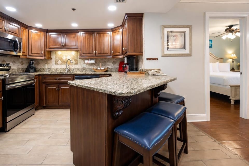 Wooden cabinets complement the granite countertops and modern stainless appliances in this inviting kitchen