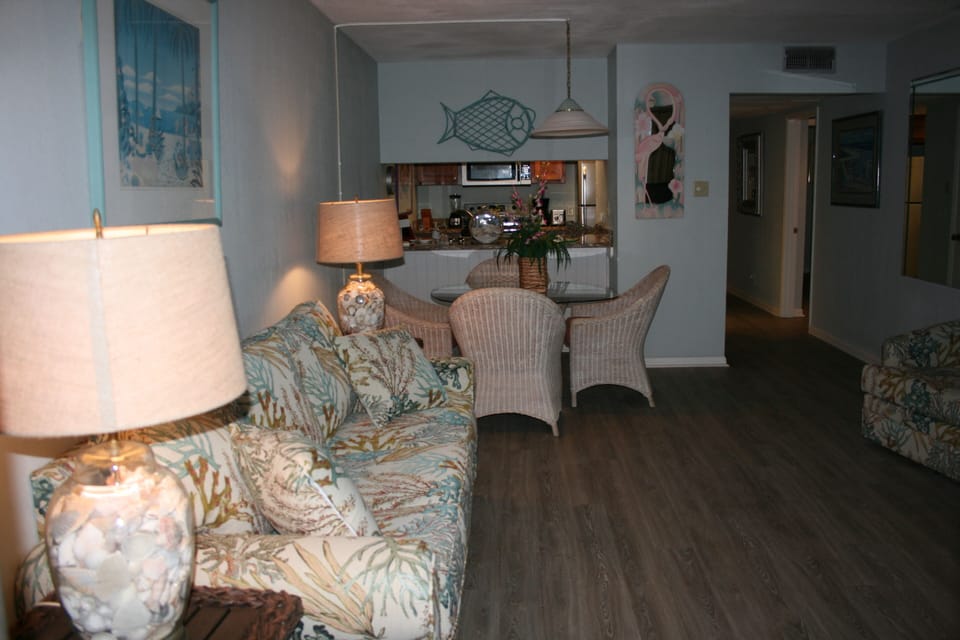 New living room furnishings and flooring, view of beach