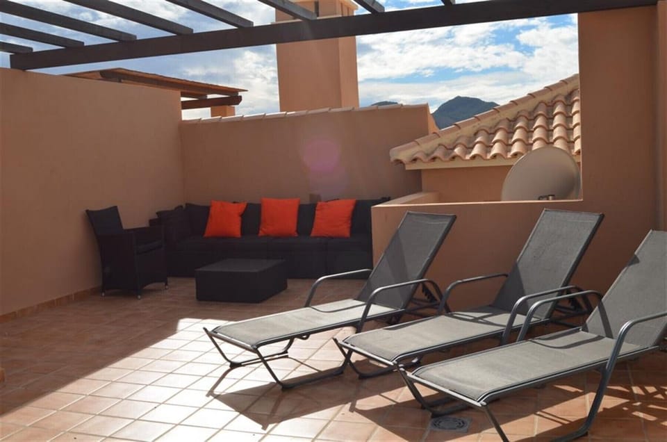 Penthouse has roof terrace well equipped with relaxing chairs