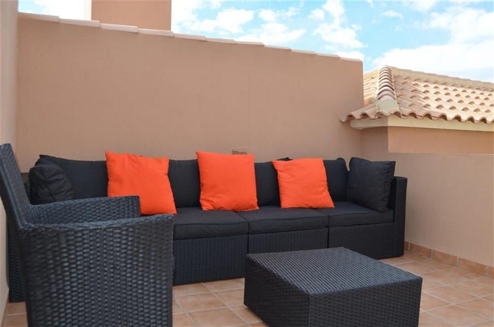 Penthouse has roof terrace with comfortable furniture