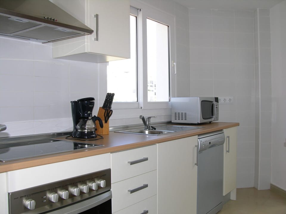 Spacious and modern kitchen including refrigerator, microwave, oven, freezer and more.
