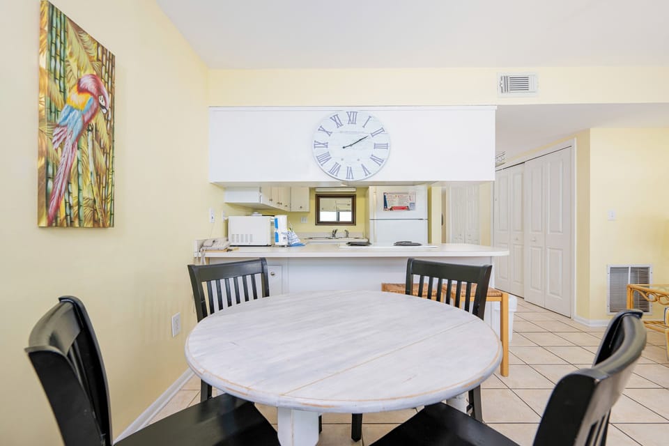 Gather around the dining table and enjoy quality time while soaking in the beach vibe from your kitchen
