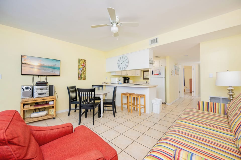 Relax in the vibrant living area while streaming your favorite shows and enjoying the coastal vibe