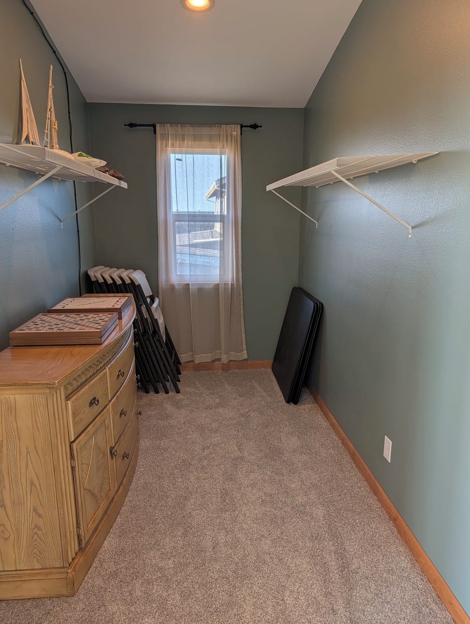 Upper level master closet with card tables for games and puzzles