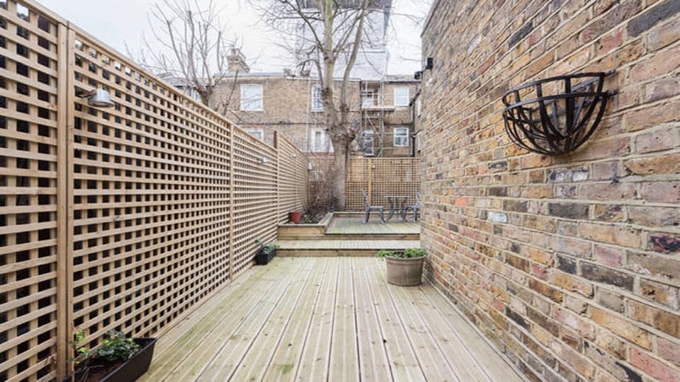 Tranquil garden, partially shaded in the summertime, and fully decked 