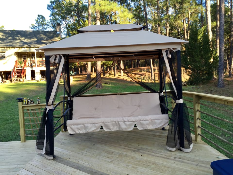 Relax and enjoy the day while sitting or lying down on this screened gazebo :)