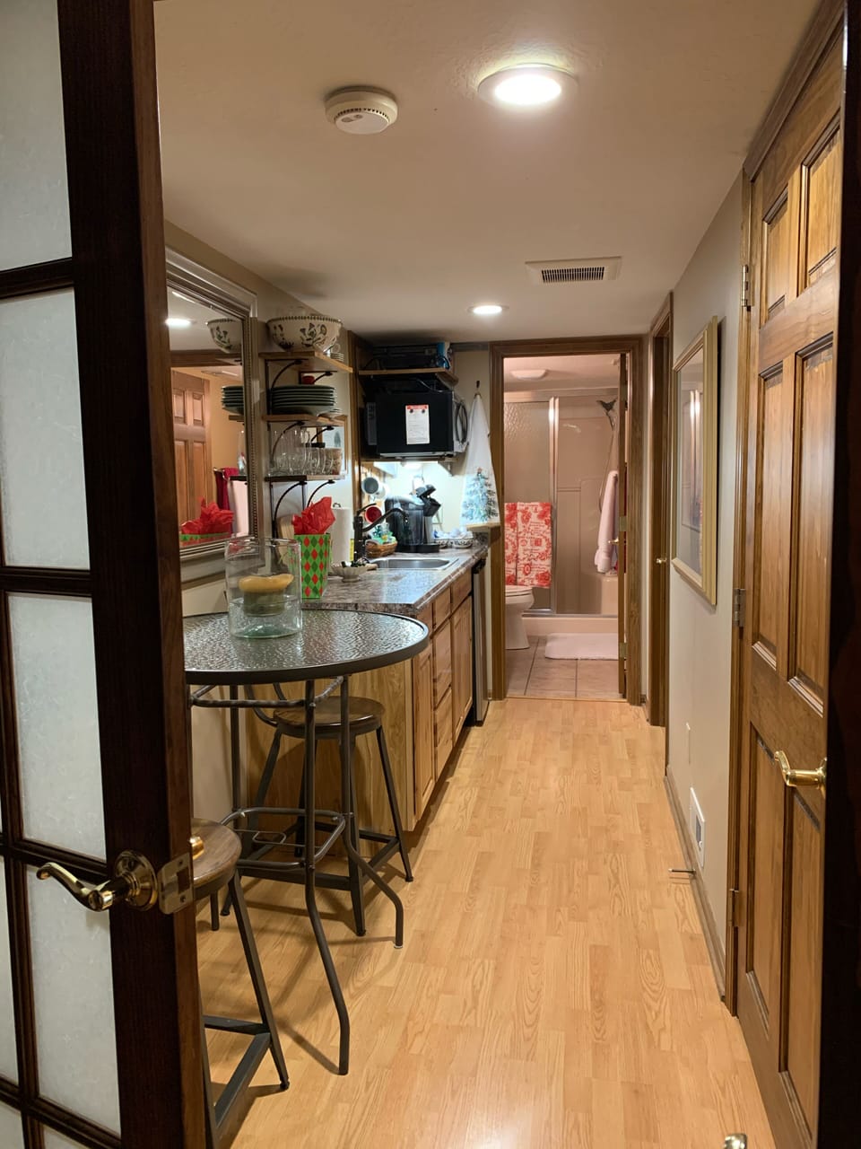 View of kitchenette and bathroom from the hallway. 