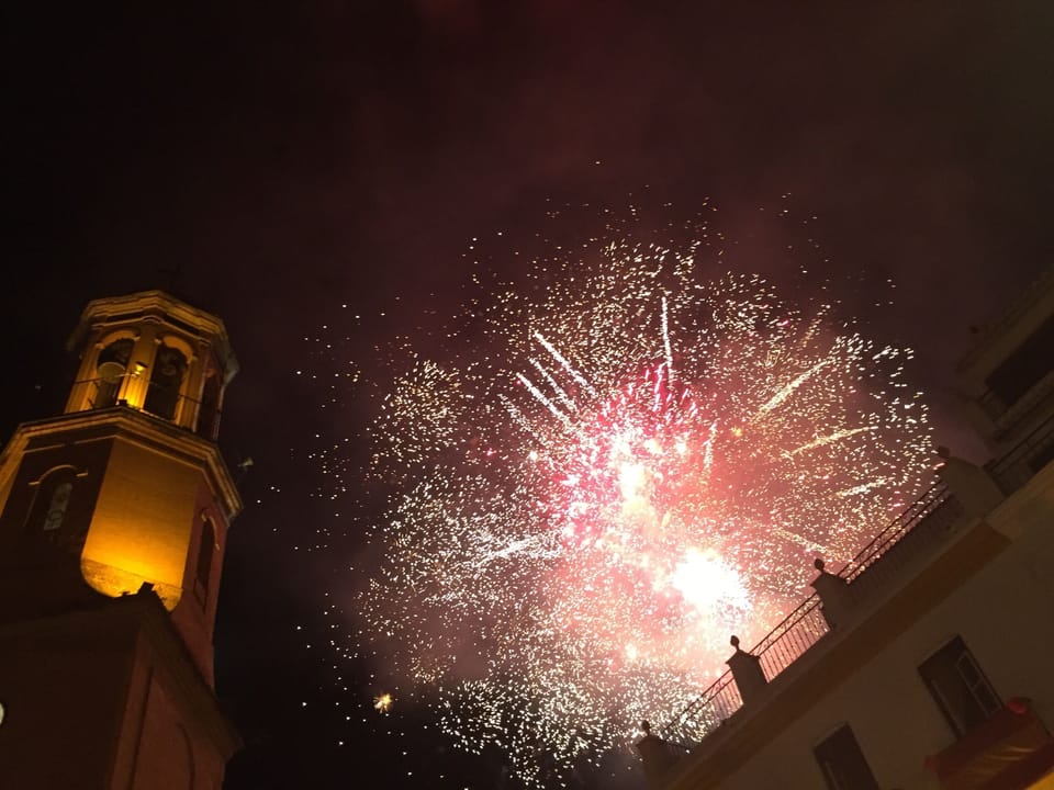 Fireworks over the church in the main square of Cómpeta.