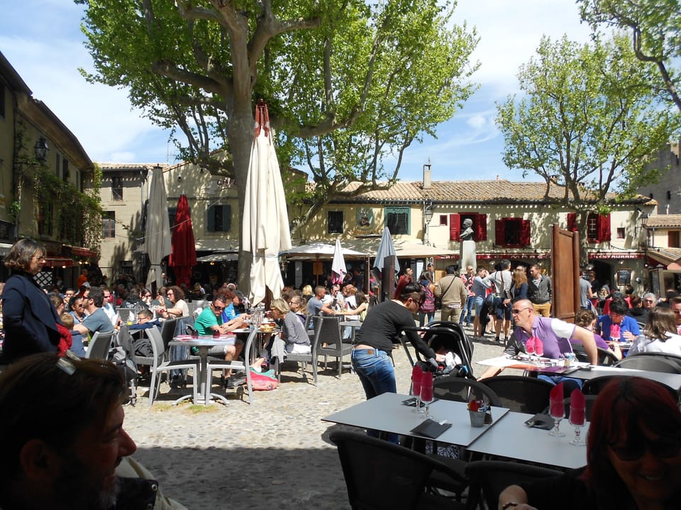 Outside dining in Place Marcou up in the Cite