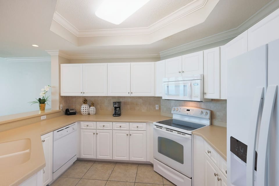 Craft delicious meals together in the bright kitchen, enjoying the seamless flow and cheerful vibe of shared moments