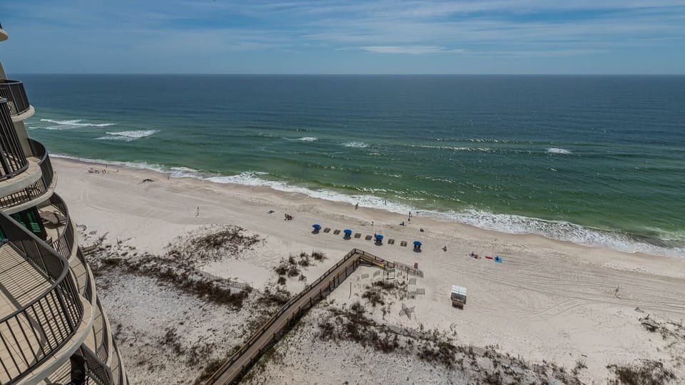 Enjoy breathtaking views of the beach and gentle waves from your balcony, perfect for relaxation
