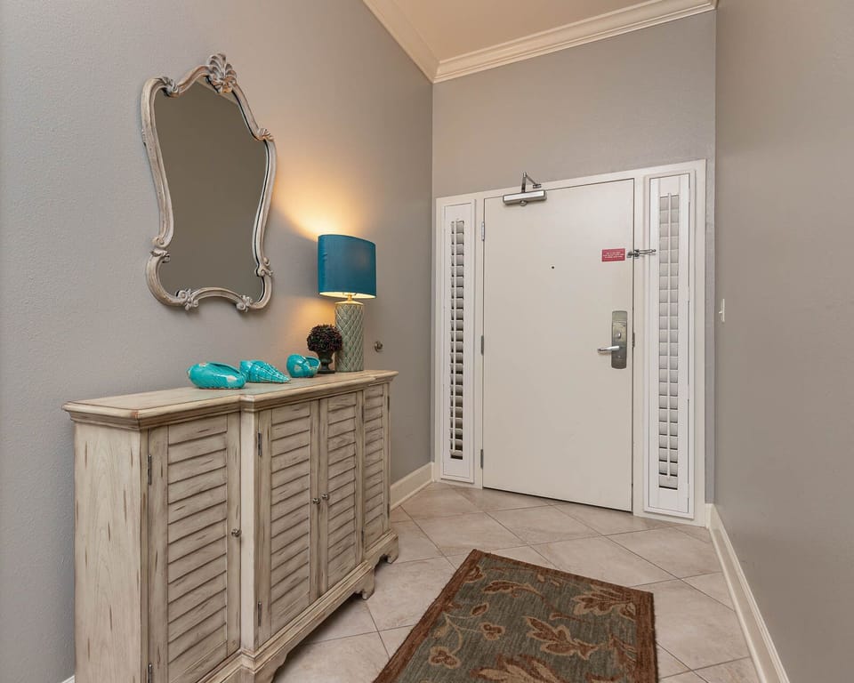 Step into this welcoming entryway, where charming decor sets the tone for your beach getaway