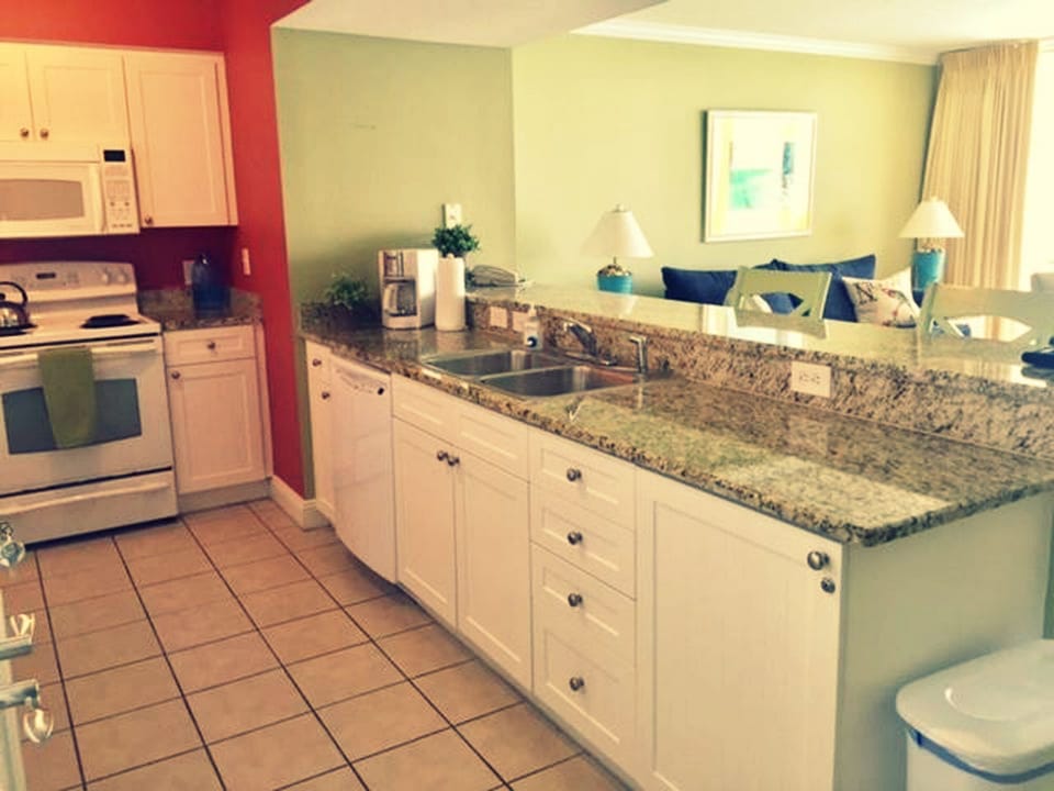 Fully equipped sunny kitchen.