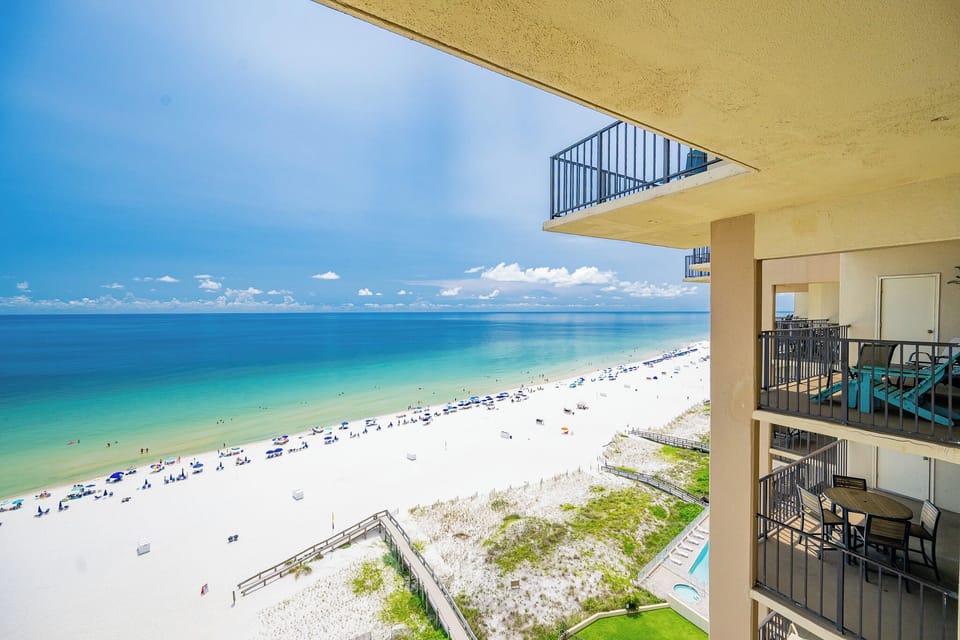 This balcony offers a breathtaking view of the turquoise waters and sandy beach, perfect for relaxation and enjoyment