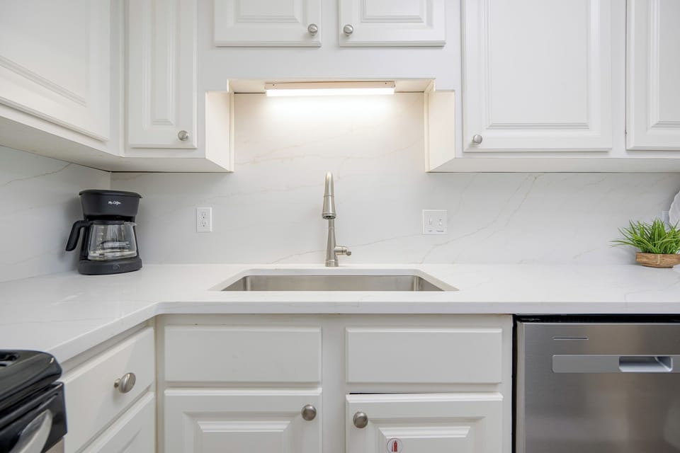 Brew a fresh cup of coffee in this stylish kitchen, ready to energize your beachside adventures
