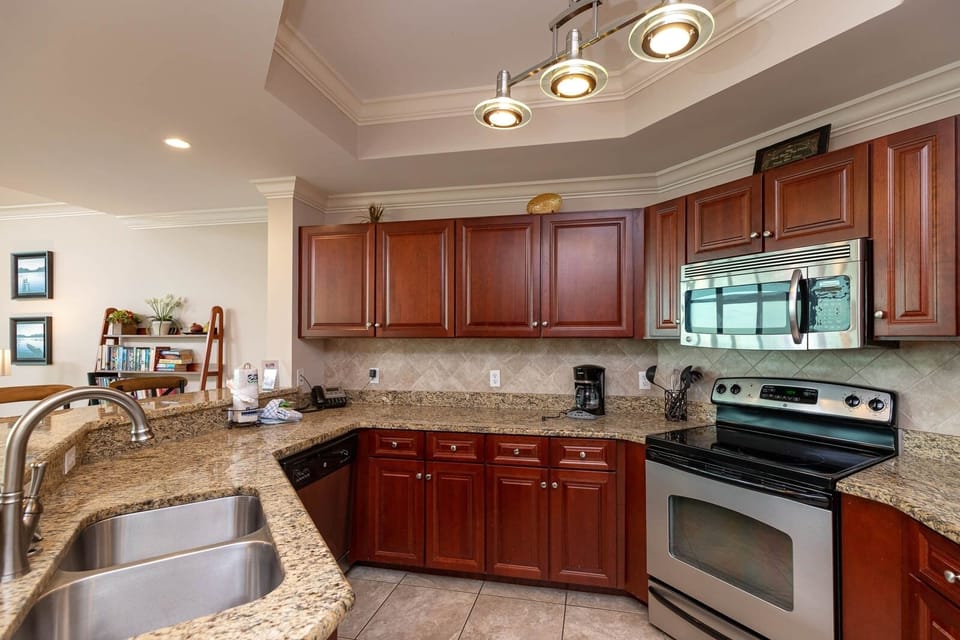 Prepare delightful meals in this kitchen, accented with warm wood tones and stainless appliances for culinary creations