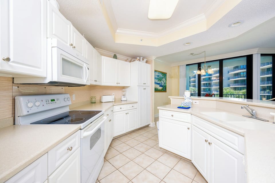 Create culinary delights in the bright kitchen, where the functional layout inspires your inner chef