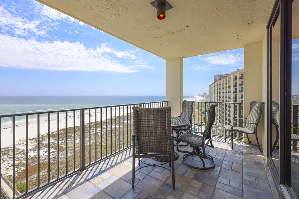 Balcony seating offers a perfect spot to enjoy the stunning beachfront view and gentle gulf breezes