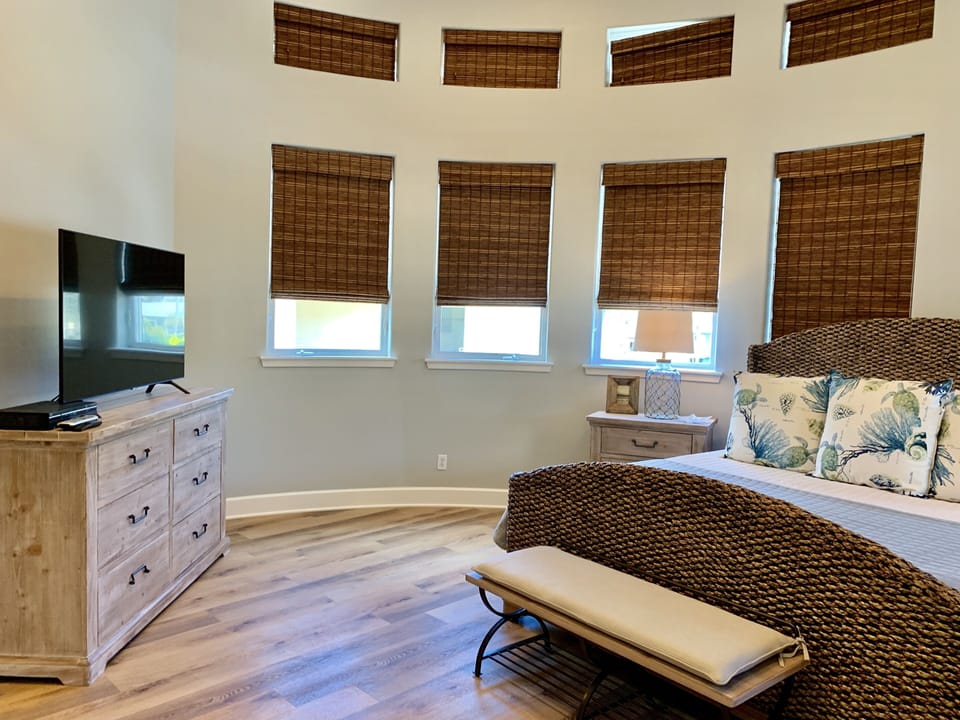 Master ensuite has King bed and 55" TV. Dresser for clothes storage, and makeup desk.