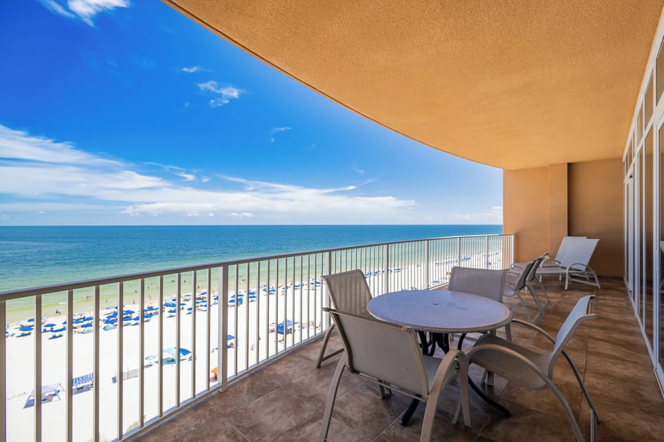 Enjoy the fresh gulf air on the spacious balcony, overlooking the beach and tranquil waters