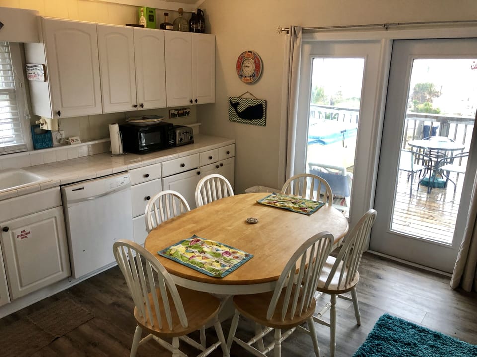 Kitchen table looking out to deck (2022)