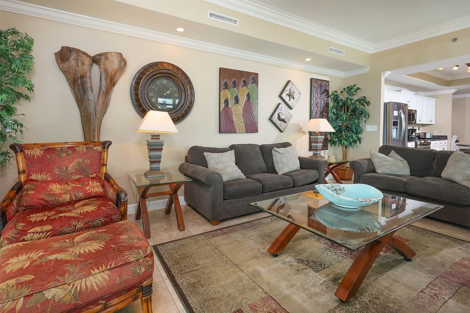 Sink into a cozy queen sofa sleeper in the living room, perfect for gathering with family after a day at the beach