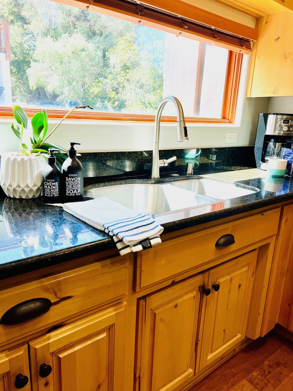 Appreciate the ease of a well-arranged kitchen that enhances the charm of your cooking endeavors.