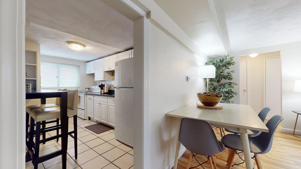Kitchen and dining area with modern furnishings.