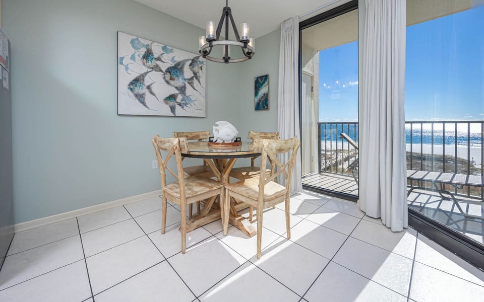 Enjoy meals with a stunning beachfront view from this inviting dining area, perfect for creating lasting memories