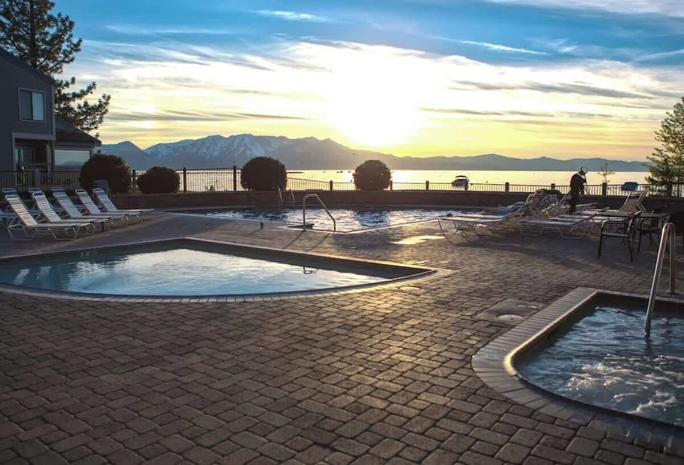 Sunset views by the pool and hot tub—your perfect spot to unwind, relax, and take in the beauty of the lake.
