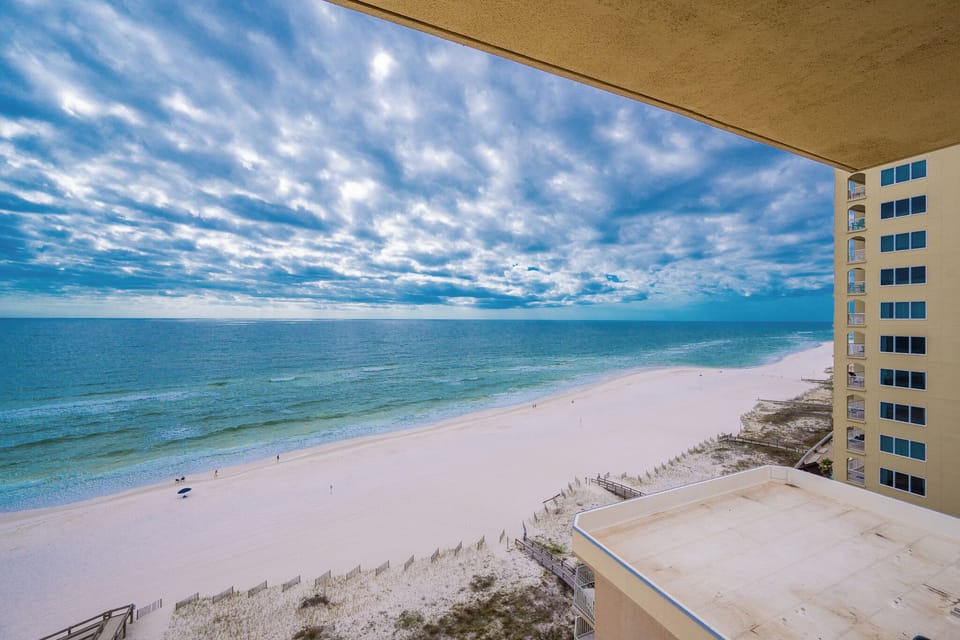 Experience breathtaking views of the beach from your private balcony, perfect for relaxation and sunset watching