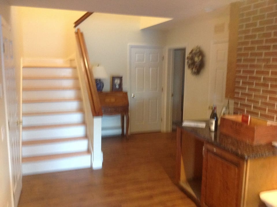 The stairs leading from the parking area to the first level.