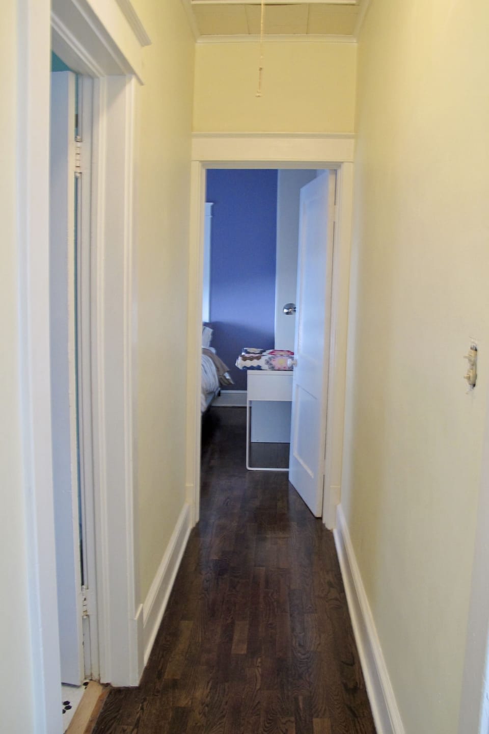 A hallway provides privacy between bedrooms.