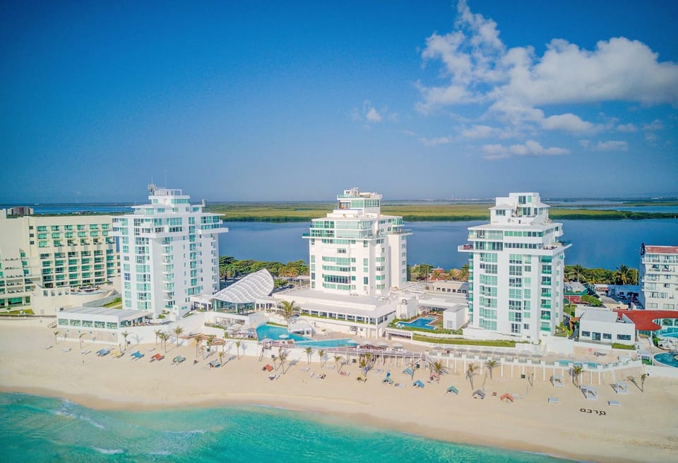 Penthouse #2701 is located in the center tower of the resort, Oleo Cancun Playa.  Photo order: The Large Private Terrace, Main Living Areas, Bedrooms &amp; Bathrooms, Resort, What’s Nearby.  More details are noted in the description.
