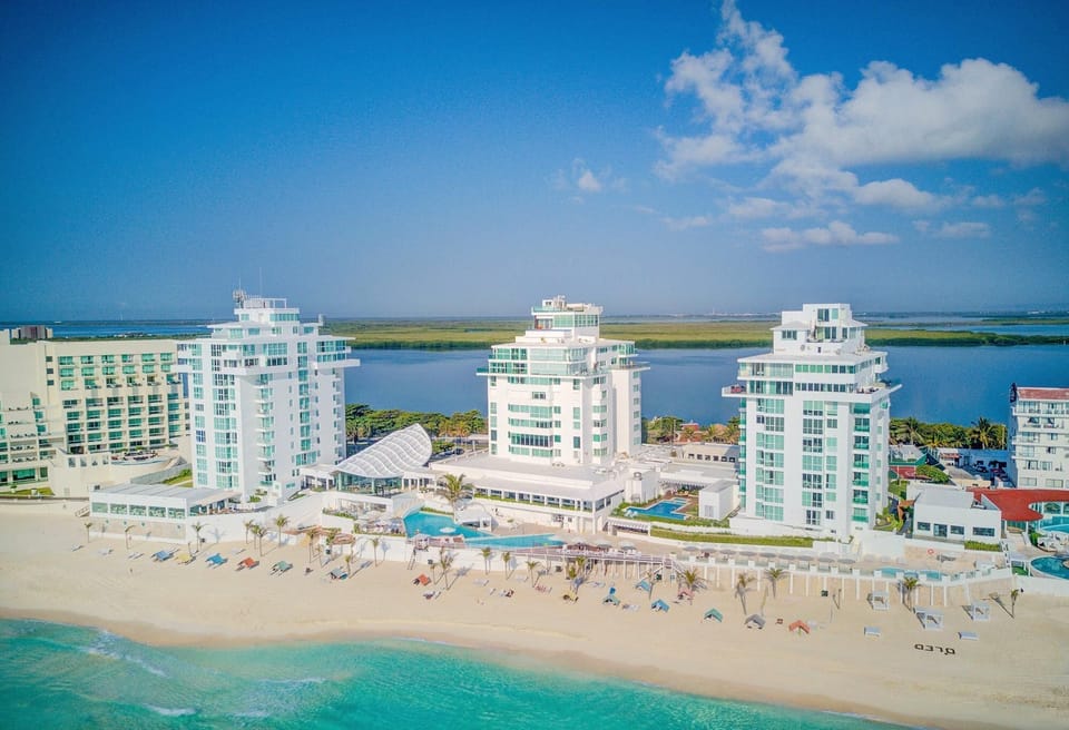 Penthouse #3702 is located in the North tower of the resort, far right, Oleo Cancun Playa.  Photo order: The Large Private Terrace, Main Living Areas, Bedrooms &amp; Bathrooms, Resort, What’s Nearby.  More details are noted in the description.