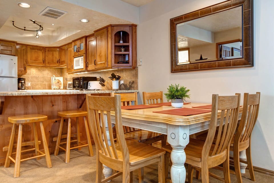 Ski Team 4: Dining Area - rustic wood table and bar stools