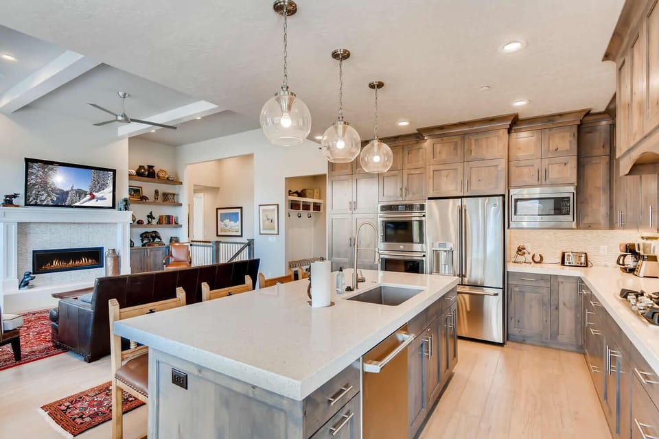 Jordanelle Estates 13299: Sleek countertop with modern appliances, perfect for culinary creations.