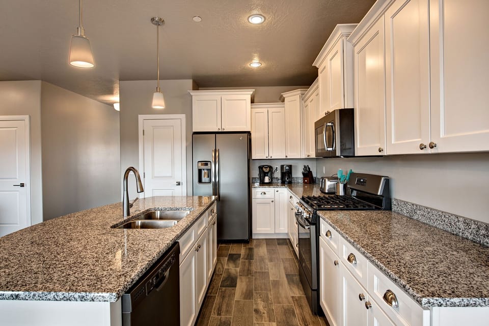 Gourmet kitchen with brand new chrome appliances & Keurig for hot choc & coffee.