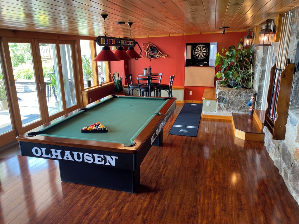 Tournament size billiard table and dart board