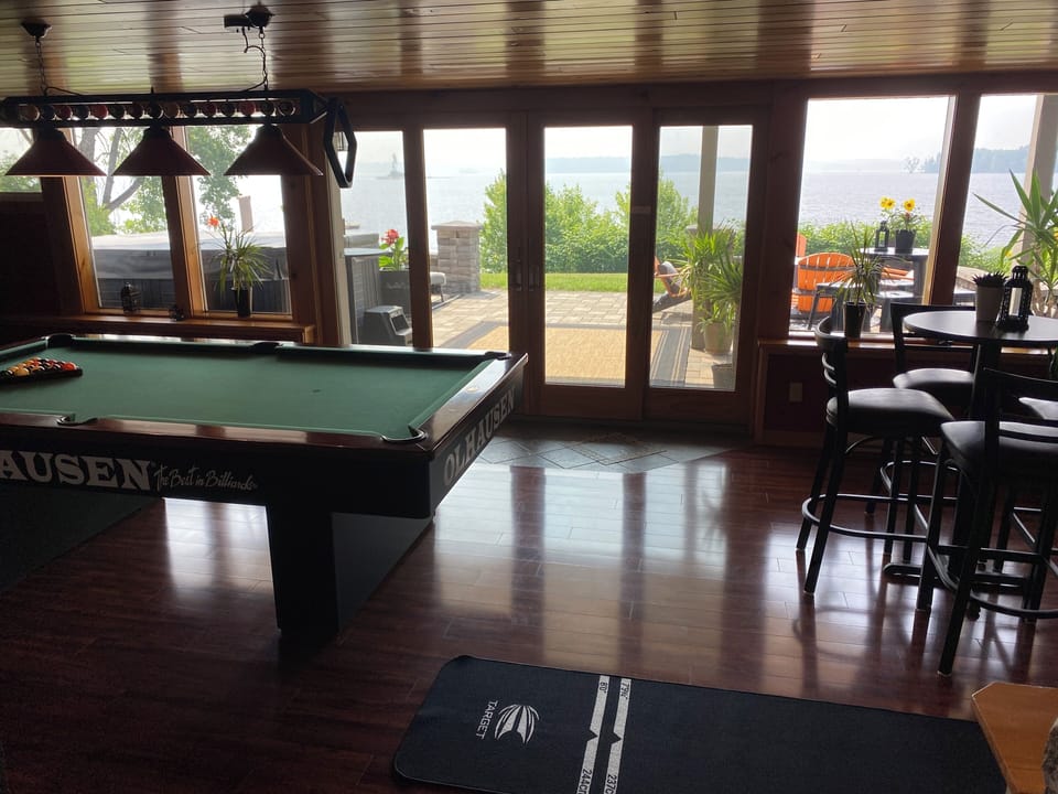 Walk out to stone patio with hot tub and gas fire pit