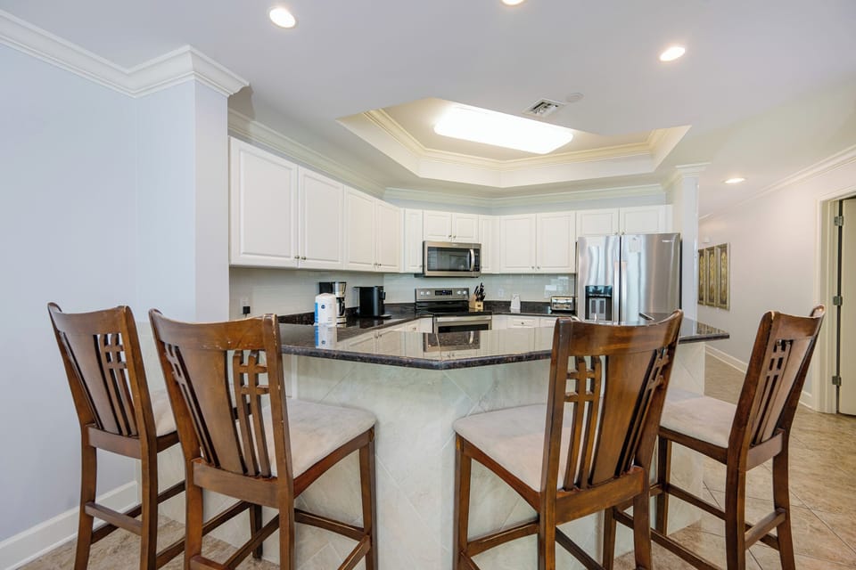 Gather around the breakfast bar to sip coffee while sharing stories and laughter with loved ones in a cozy space