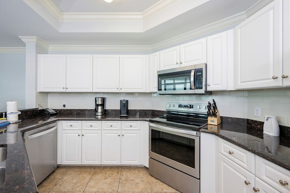 Create delicious meals in this inviting kitchen, surrounded by stainless appliances and ample counter space