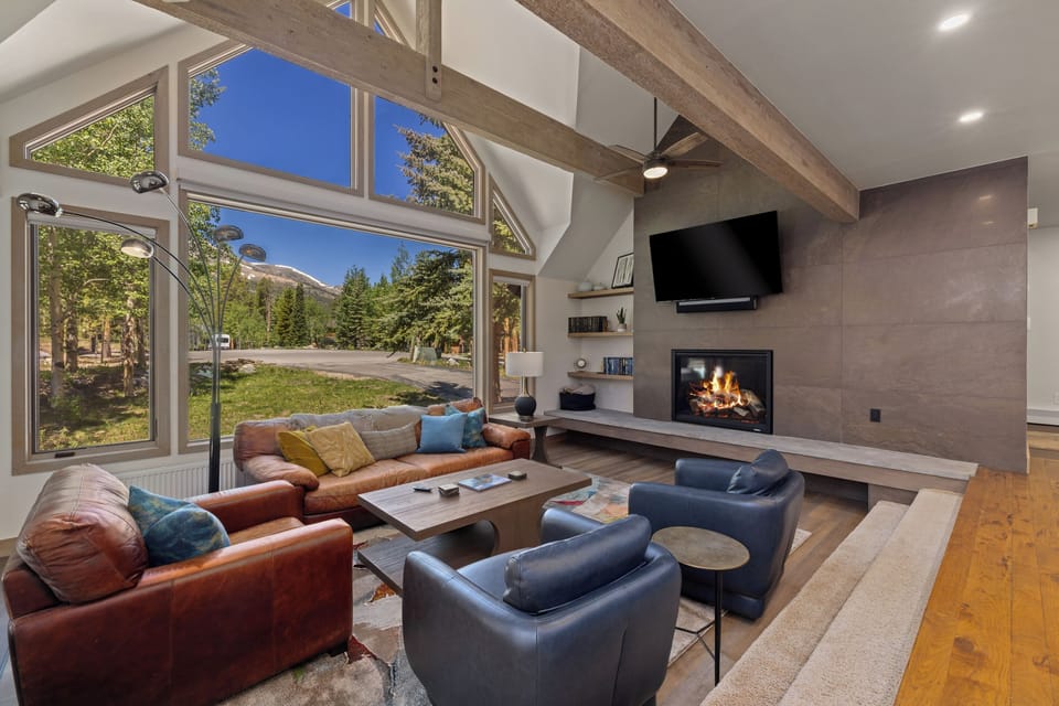 Main living room, patio door to deck, grill and hot tub.