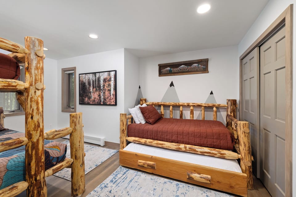 Bedroom #6 Bunk room – Sleeps 5 - one queen Bed, and three twin beds - Wall Mounted HDTV & Games, childproof plugs.