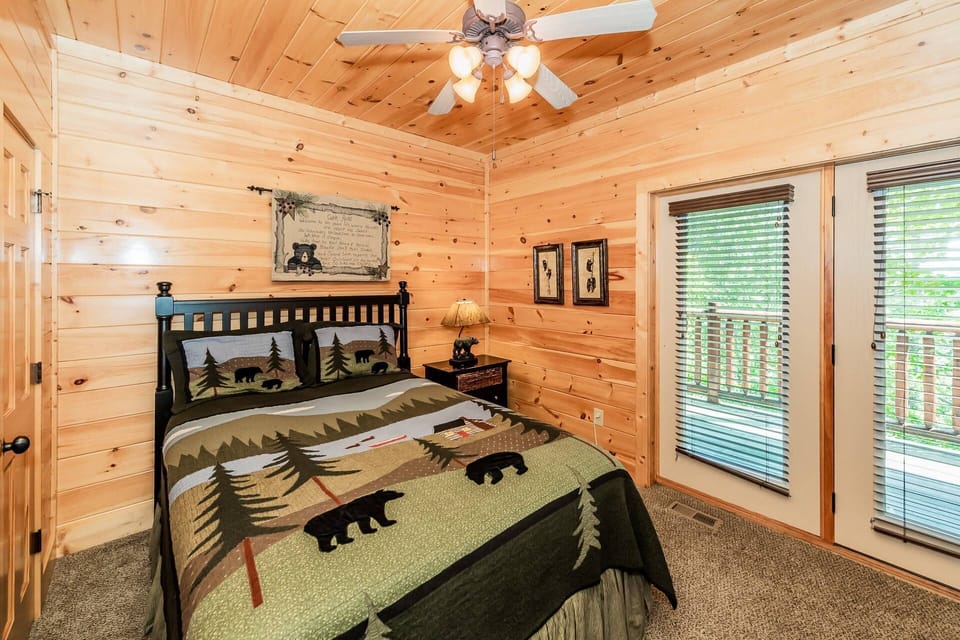 This downstairs bedroom offers a queen bed