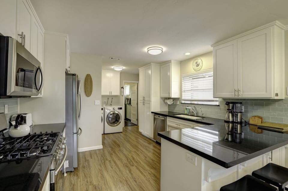 Modernized kitchen equipped with top-notch chef-grade appliances, perfect for crafting delectable culinary delights.