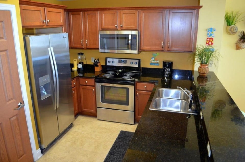 Gourmet Kitchen with new appliances.  Well stocked with dishes, pots and pans.
