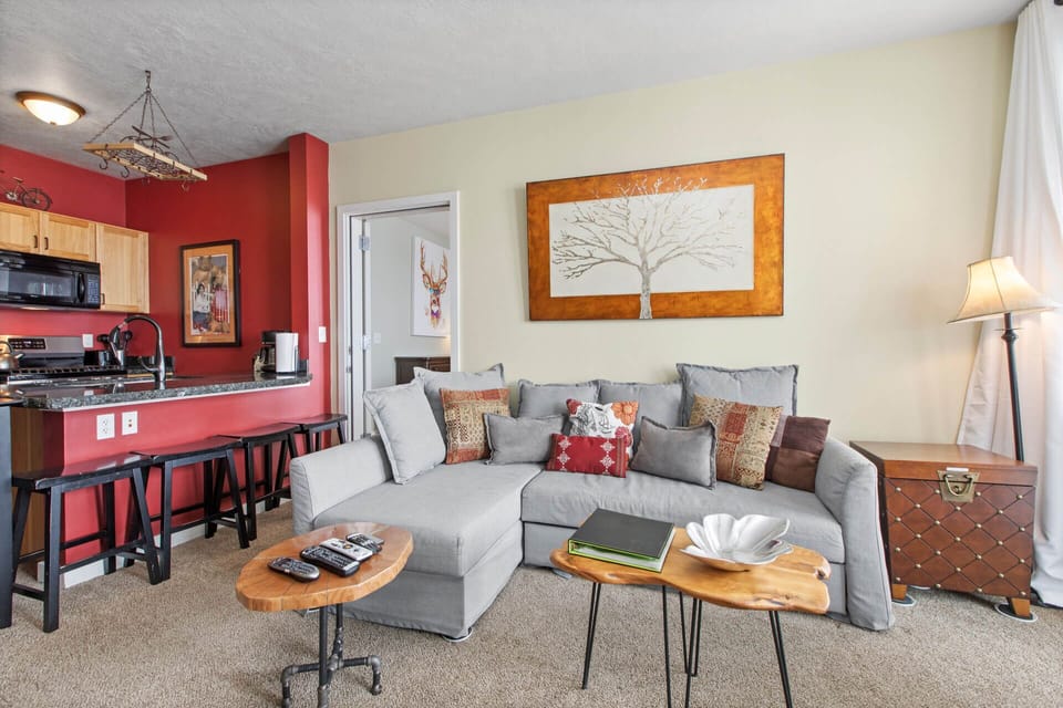 The Mason at Stillwater 2013: Cozy sofa set with stylish bar stools for a modern touch.