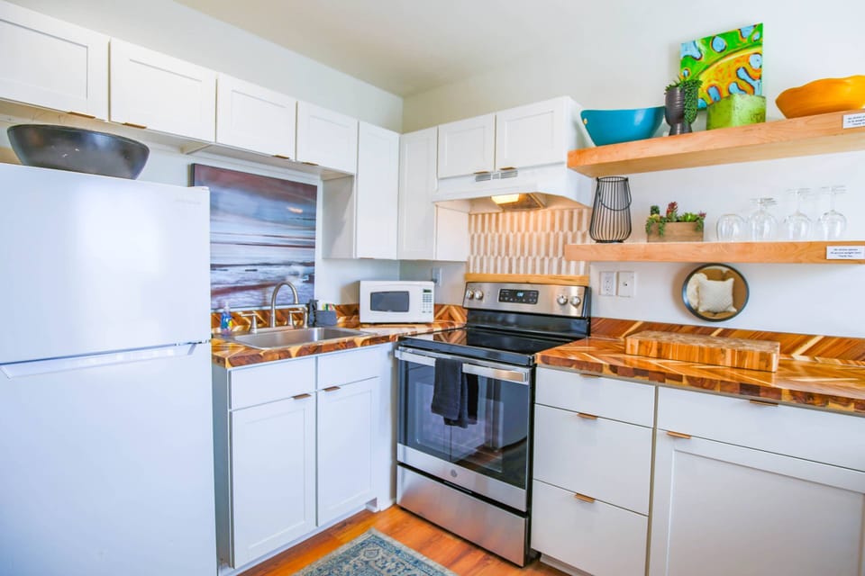 When you enter the front door, you'll find the kitchen, dining area and living room.